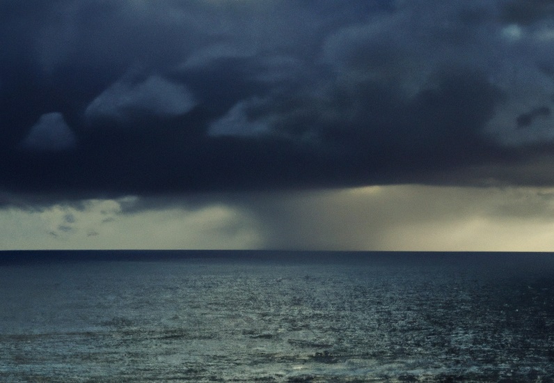 storm clouds over a sea being compared to an incoming economic recession
