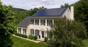 Home with solar panels on its roof, installed by a green energy company that needed marketing help.