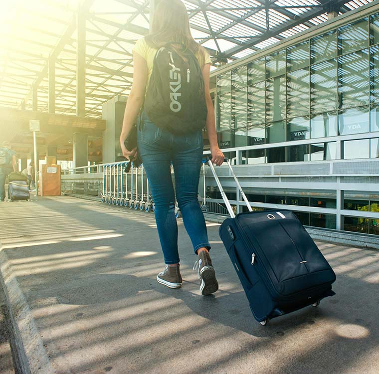 A traveler strolling through Vancouver International Airport in Richmond