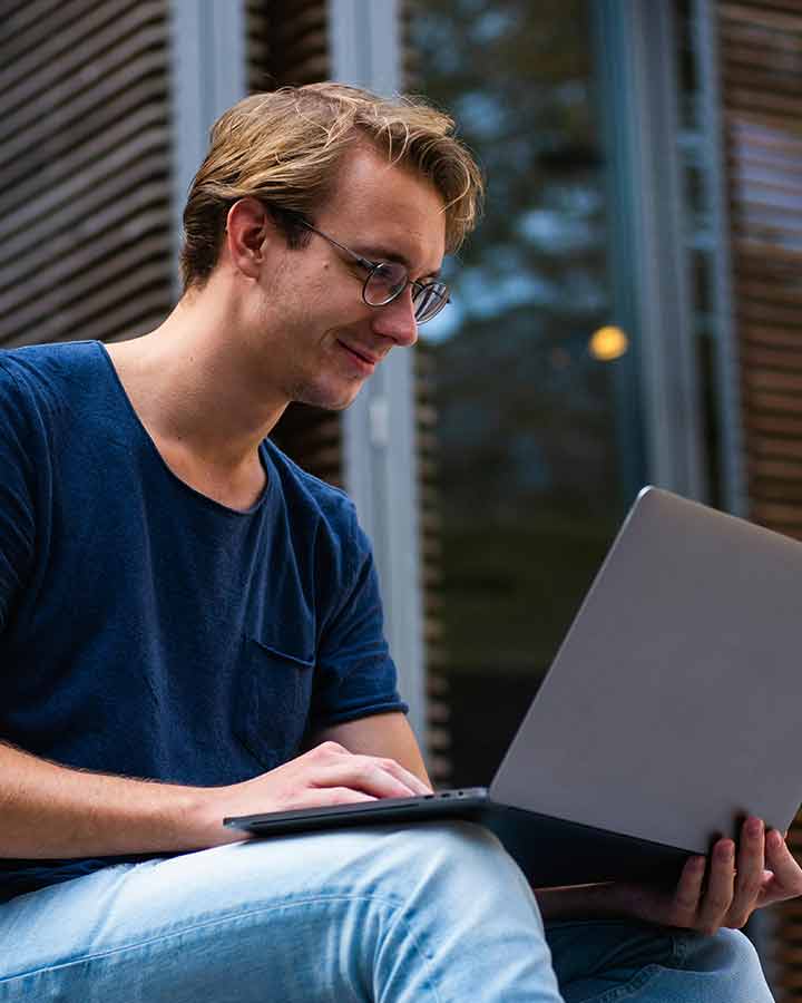 Student using lapptop from Laurier Brantford’s downtown campus