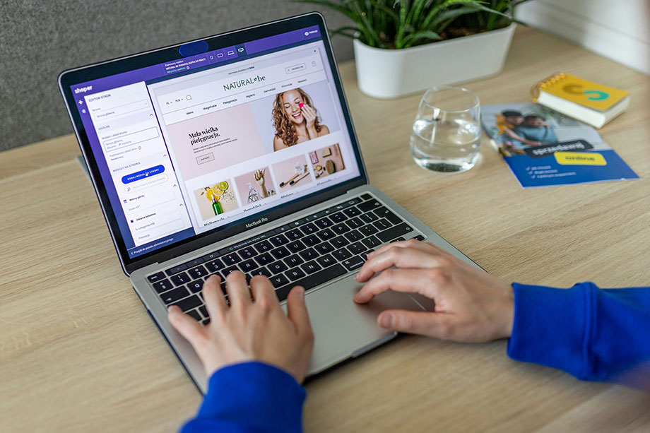 A Small Business Owner Setting Up An Ecommerce Website For Marketing