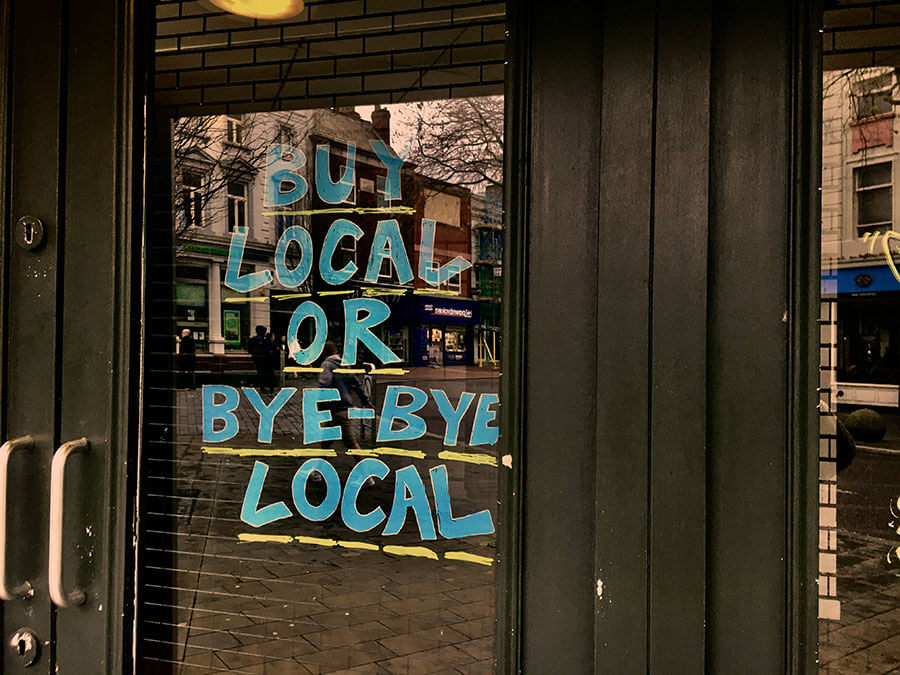 Get Found Through Local SEO - Slogan on Door Says Buy Local Or Bye Bye Local