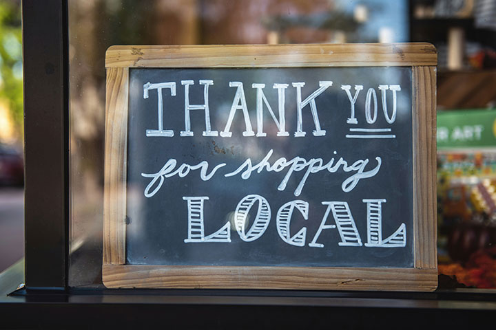 Getting found through local SEO and having a sign saying “thank you for shopping local”