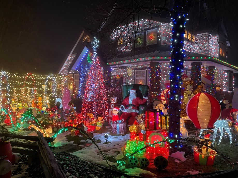An elaborate display of Christmas lights and decorations on Flavio's front lawn and house