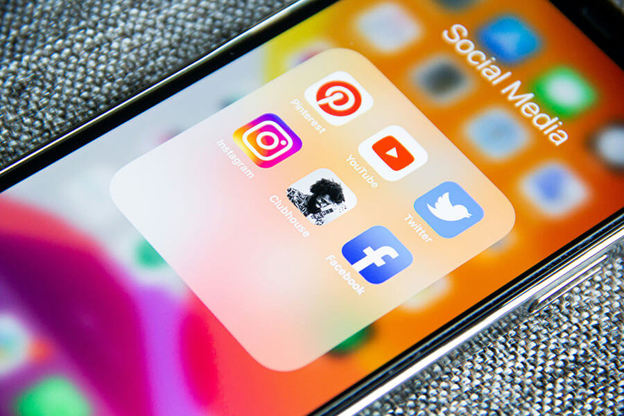 Social Media icons on a phone to demonstrate Social Media Marketing options.