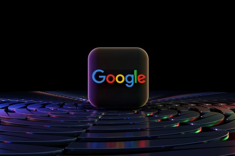 The Google logo in a black 3d square tile