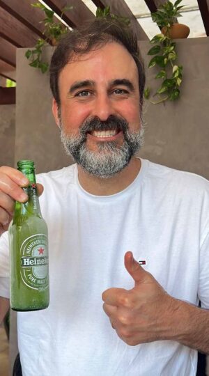 Nilo, head of Creative Services, with a beer