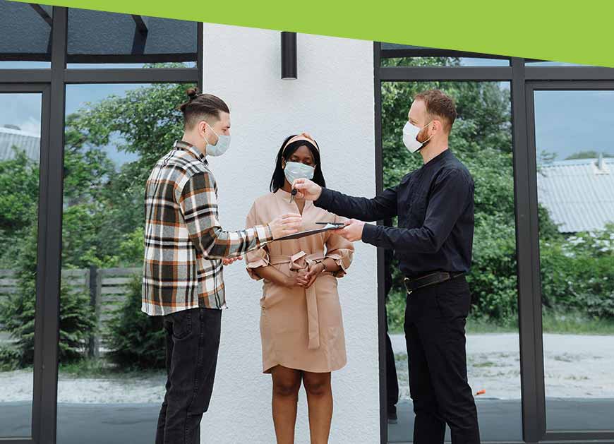 Real estate agent handing over keys to a client
