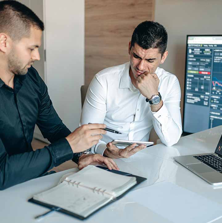 Two men making contracts for cross-border commerce in Niagara Falls, Ontario