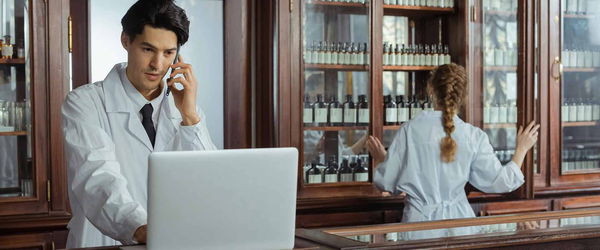 Pharmacy professionals managing prescriptions, inventory, and patient information