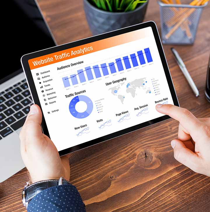 Man looking at a dashboard with data in the professional services sector in Pickering, Ontario
