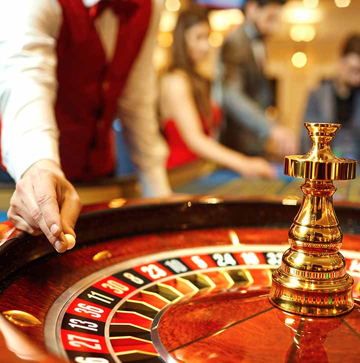 Dealer preparing to spin the wheel at the Pickering Casino Resort
