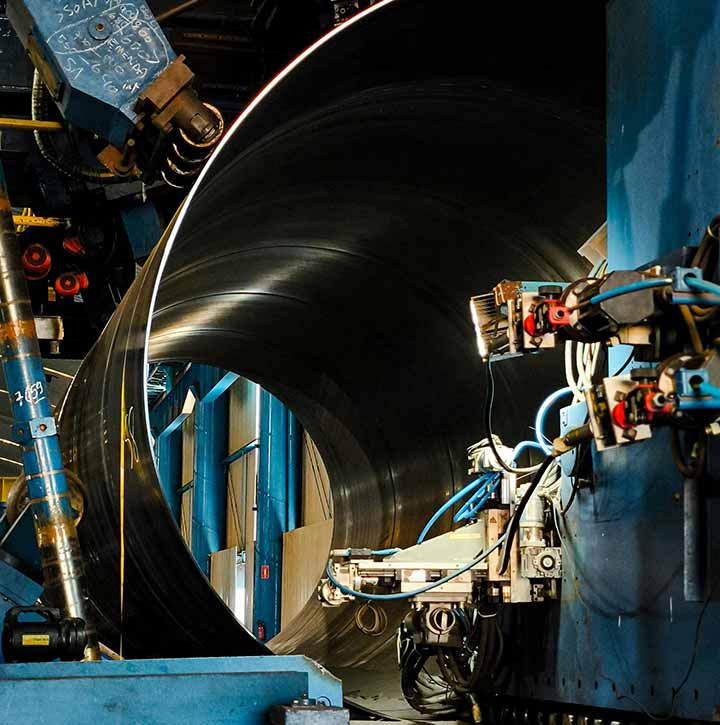 A spiral pipe welding machine at a steel manufacturing facility in Sault Ste. Marie, Ontario