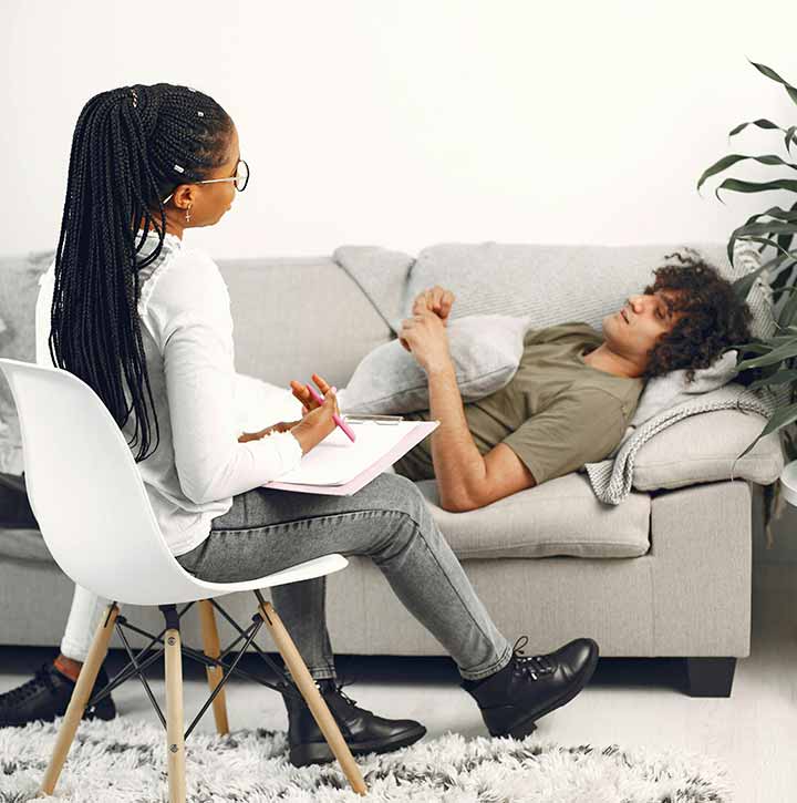 A mental healthcare professional consulting with a patient