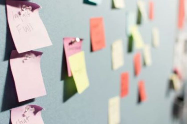 sticky-notes-map colourful sticky notes pinned to a board to map out a content plan for your website