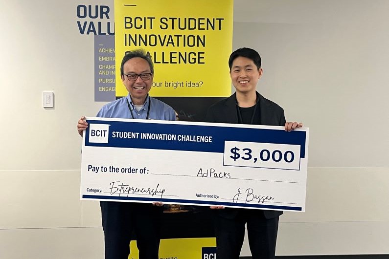 BCIT grad and Snaptech intern, Andy, with a $3000 AdPacks cheque, cover size