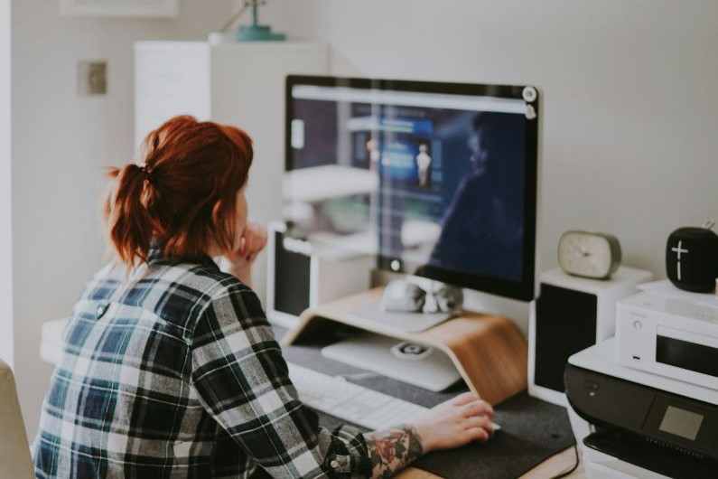 Woman At Computer Working On Marketing - cover size