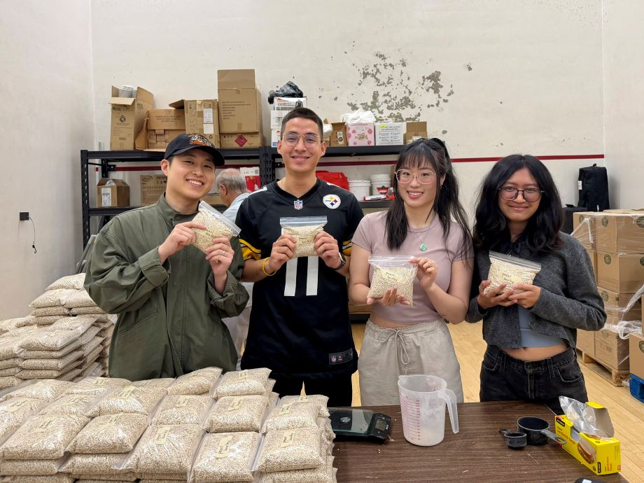 Group Vounteer Steph Wan and some other team members volunteering with the South Vancouver Community Hub
